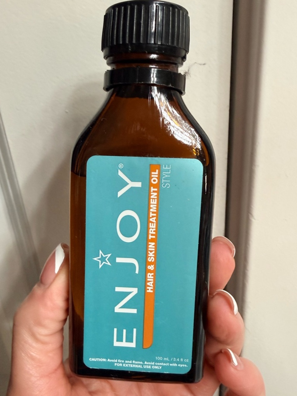 Enjoy hair and skin treatment oil